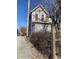 Side view of a neglected house needing renovation, with a fence and trees at , Indianapolis, IN 46202