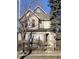 Two-story home needing renovation, featuring boarded windows and a weathered exterior at , Indianapolis, IN 46202