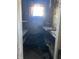 A small, damaged room with shelves and a window at , Indianapolis, IN 46202