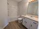 Clean bathroom with a tub, shower, vanity, and neutral flooring at 7841 Harbour # 35, Indianapolis, IN 46240