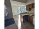 Open concept kitchen with wood cabinets and access to the dining area at 7841 Harbour # 35, Indianapolis, IN 46240