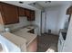 Kitchen with wood cabinets, laminate countertops, and a breakfast bar at 7841 Harbour # 35, Indianapolis, IN 46240