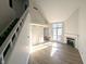 Sunlit living room showcasing vaulted ceilings, fireplace, and hardwood floors at 7841 Harbour # 35, Indianapolis, IN 46240