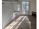 Bright living room with hardwood floors, fireplace, and access to deck at 7841 Harbour # 35, Indianapolis, IN 46240