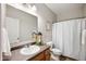 Bathroom with classic fixtures, neutral-toned walls, and framed mirror at 8535 Blue Marlin Dr, Indianapolis, IN 46239