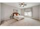 Cozy bedroom with neutral tones, comfortable bed, and window offering natural light at 8535 Blue Marlin Dr, Indianapolis, IN 46239