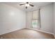 Bright bedroom with wood-look flooring, shiplap wall, and a window with peaceful view at 8535 Blue Marlin Dr, Indianapolis, IN 46239