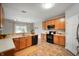 Well-lit kitchen showcasing wooden cabinets, stainless steel appliances, and modern lighting fixtures at 8535 Blue Marlin Dr, Indianapolis, IN 46239