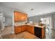 Bright kitchen featuring wooden cabinets, neutral countertops, and stainless steel sink with modern fixtures at 8535 Blue Marlin Dr, Indianapolis, IN 46239