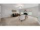 Spacious living room showcases neutral walls, carpeted floors, comfortable seating, and a fireplace at 8535 Blue Marlin Dr, Indianapolis, IN 46239