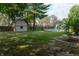 Large backyard with inground pool, shed, and patio at 877 Revere Ct, Greenwood, IN 46142
