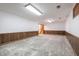 Unfinished basement with wood paneling, concrete floors and access to stairs at 877 Revere Ct, Greenwood, IN 46142