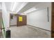 Empty basement room with concrete floor and sliding doors at 877 Revere Ct, Greenwood, IN 46142