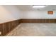Unfinished basement with wood paneling and concrete floors at 877 Revere Ct, Greenwood, IN 46142