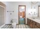 Bathroom with double vanity, shower, and toilet at 877 Revere Ct, Greenwood, IN 46142