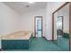 Bathroom with jacuzzi tub, mirrored closet doors and access to other rooms at 877 Revere Ct, Greenwood, IN 46142