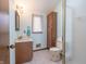 Small bathroom with wood cabinets and tiled floor at 877 Revere Ct, Greenwood, IN 46142
