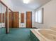 Main bathroom with bathtub and mirrored closet at 877 Revere Ct, Greenwood, IN 46142