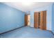 Blue bedroom with built-in shelving at 877 Revere Ct, Greenwood, IN 46142