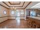 Dining room with hardwood floors, chandelier, and kitchen access at 877 Revere Ct, Greenwood, IN 46142