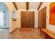 Spacious entryway with double doors, coat hooks, and tile floors at 877 Revere Ct, Greenwood, IN 46142