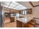 Kitchen with wood cabinets and island with seating at 877 Revere Ct, Greenwood, IN 46142