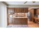 Spacious kitchen with an island, wooden cabinets, and hardwood floors at 877 Revere Ct, Greenwood, IN 46142