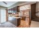 Kitchen with wood cabinets and views to dining area at 877 Revere Ct, Greenwood, IN 46142
