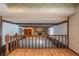 View of a living room with a stone fireplace from a split level at 877 Revere Ct, Greenwood, IN 46142