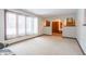 Living room with carpeted floor, large windows, and view of entryway at 877 Revere Ct, Greenwood, IN 46142