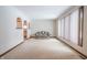 Living room with carpeted floor and large windows at 877 Revere Ct, Greenwood, IN 46142