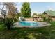 Inviting inground pool with slide and lounge chairs at 877 Revere Ct, Greenwood, IN 46142