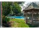 Serene pool area with gazebo and lush landscaping at 877 Revere Ct, Greenwood, IN 46142