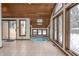 Sunroom with tiled floor and hot tub at 877 Revere Ct, Greenwood, IN 46142