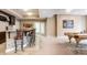 Finished basement featuring a bar area with seating, a pool table, and neutral décor at 9399 Irishmans Run Ln, Zionsville, IN 46077