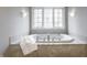 Well-lit bathroom with a soaking tub at 9399 Irishmans Run Ln, Zionsville, IN 46077
