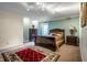 Cozy bedroom features a plush bed, a red accent rug, and elegant dark wood furnishings at 9399 Irishmans Run Ln, Zionsville, IN 46077