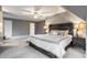 Cozy bedroom with unique wooden headboard, carpet, and ensuite bath at 9399 Irishmans Run Ln, Zionsville, IN 46077