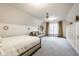 Bright bedroom with neutral tones, a comfortable bed, and built-in closet storage at 9399 Irishmans Run Ln, Zionsville, IN 46077