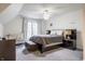 Stylish bedroom featuring modern furnishings, a cozy bed, and natural light from the window at 9399 Irishmans Run Ln, Zionsville, IN 46077