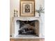 Detailed view of the fireplace, highlighting its mantel and brickwork at 9399 Irishmans Run Ln, Zionsville, IN 46077