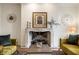 Close-up of the ornate fireplace featuring a decorative mantel and hearth at 9399 Irishmans Run Ln, Zionsville, IN 46077