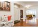 Spacious foyer showcasing hardwood floors, arched doorways, and a cozy seating area at 9399 Irishmans Run Ln, Zionsville, IN 46077