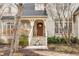 Inviting front entrance with a covered porch and a beautifully landscaped walkway at 9399 Irishmans Run Ln, Zionsville, IN 46077