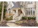 Inviting front entrance with a covered porch and a beautifully landscaped walkway at 9399 Irishmans Run Ln, Zionsville, IN 46077
