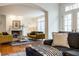 Open-concept living space with a fireplace, comfortable seating, and bright lighting at 9399 Irishmans Run Ln, Zionsville, IN 46077