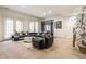 Spacious living room featuring modern seating, elegant decor, and bright natural light at 9399 Irishmans Run Ln, Zionsville, IN 46077