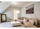 Comfortable living space featuring a curved sofa, contemporary decor, and stylish lighting at 9399 Irishmans Run Ln, Zionsville, IN 46077