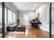 Bright office space with hardwood floors, desk, and natural light from the windows at 9399 Irishmans Run Ln, Zionsville, IN 46077