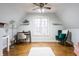 Charming home office with hardwood floors, a large window, and decorative shelving at 9399 Irishmans Run Ln, Zionsville, IN 46077